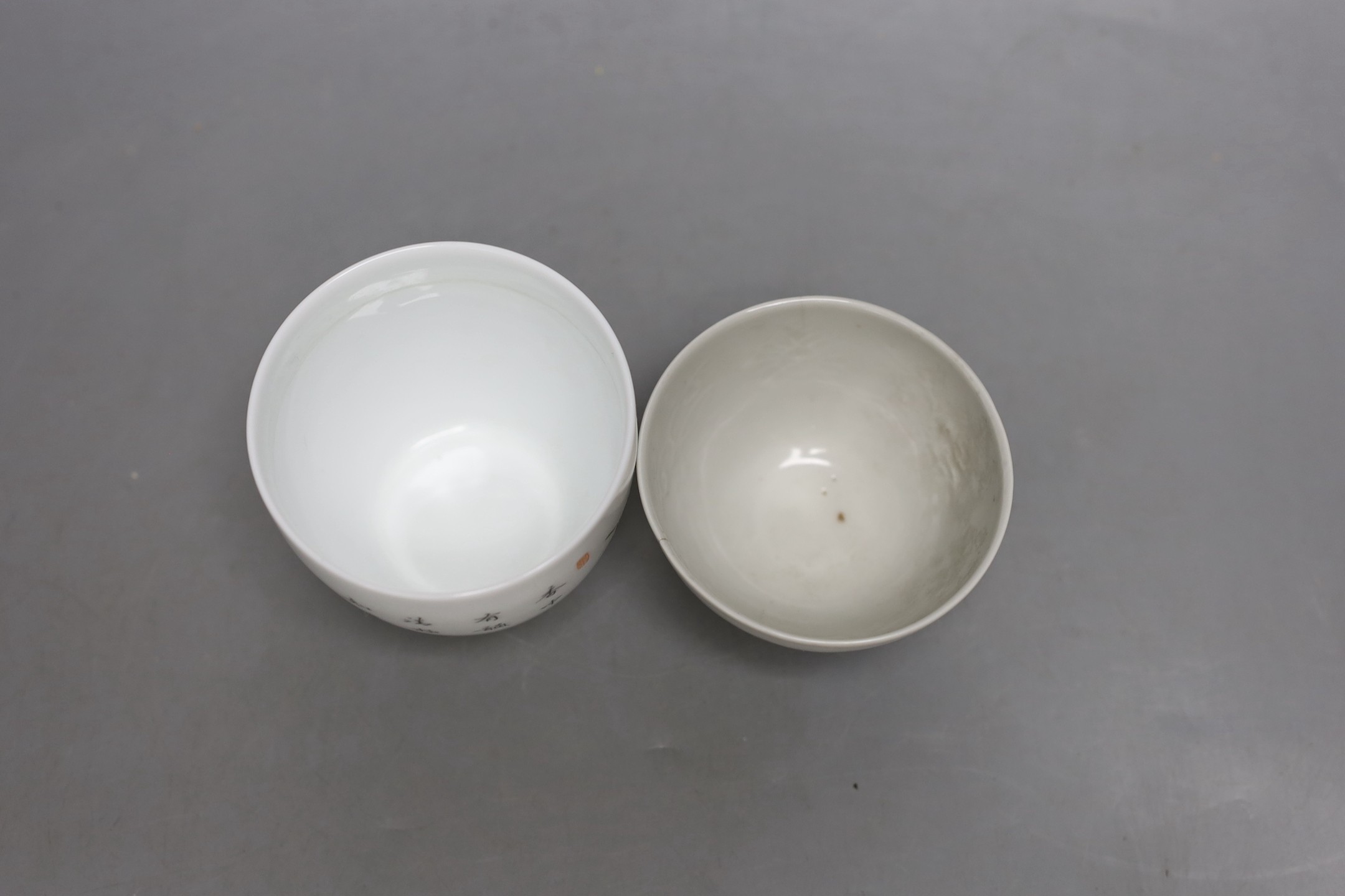 A Chinese internally moulded porcelain cup and a famille rose cup, 7cms high